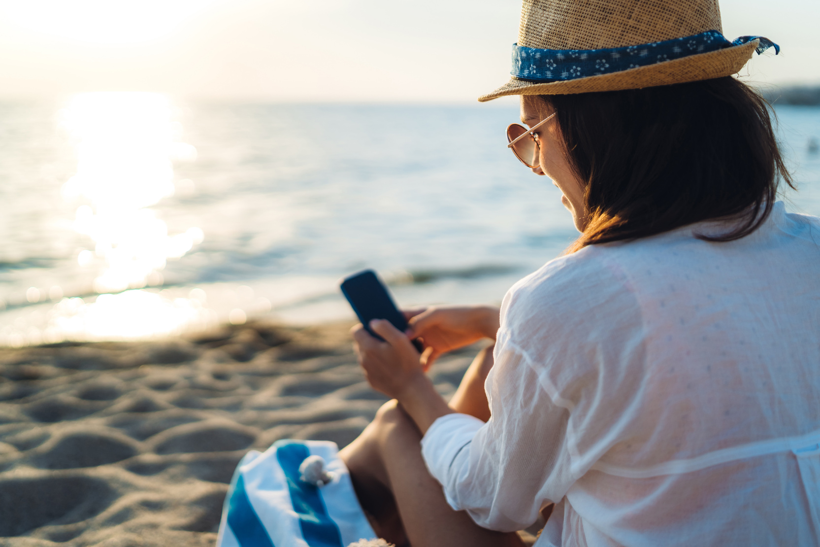 Using phone at the beach